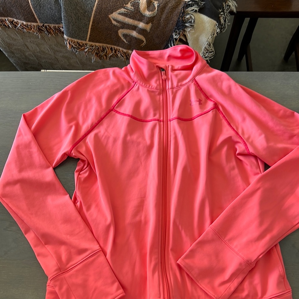 Under Armour semi fitted medium full zip jacket with two pockets. Worn once.